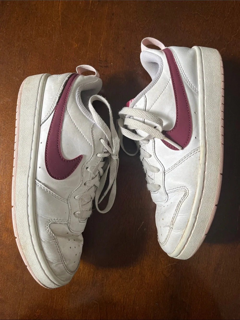 Nike Kids White Sneakers with Maroon Swoosh and Light Pink Details